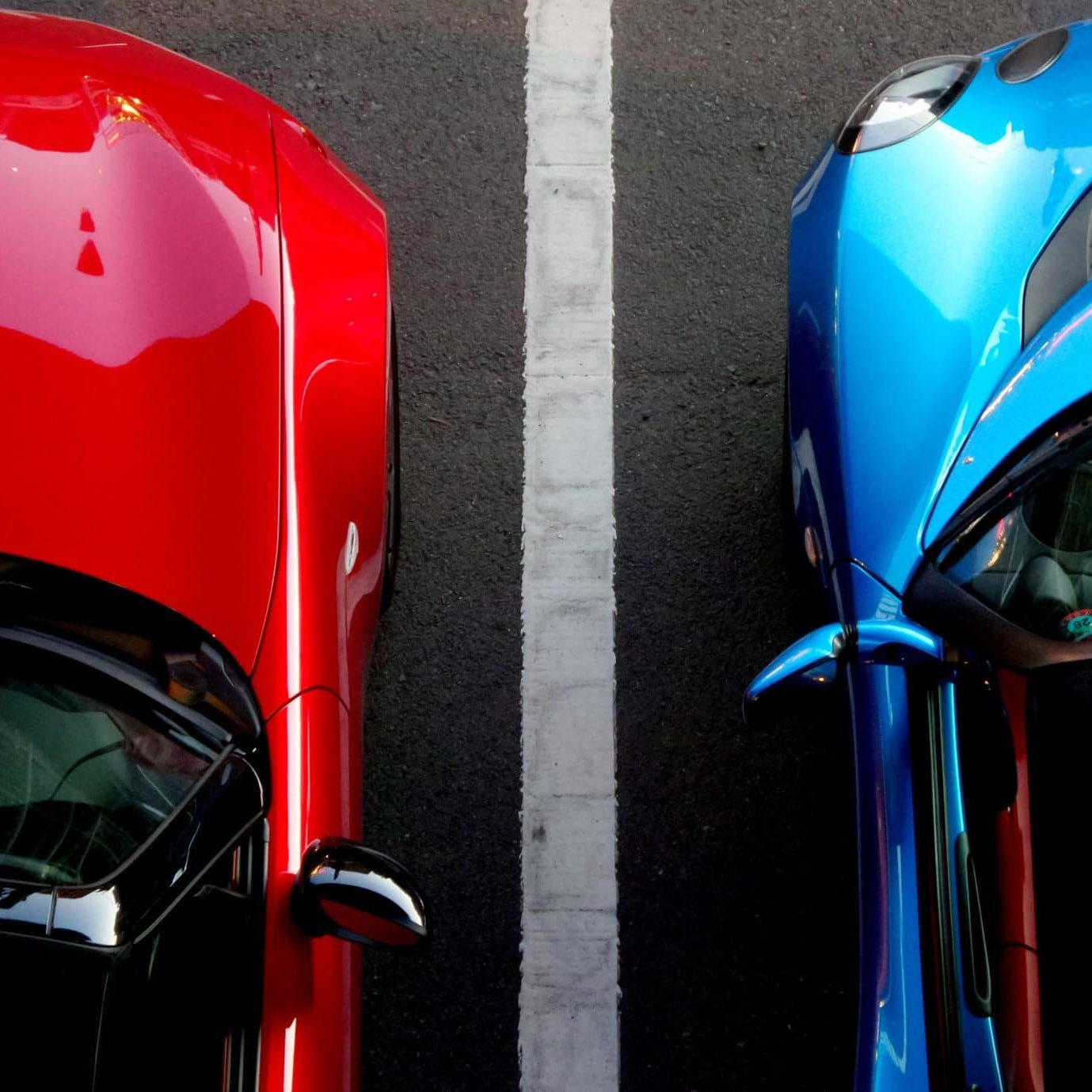 Red and blue cars for color matching on services page, Dent Busters in Tucson, Arizona